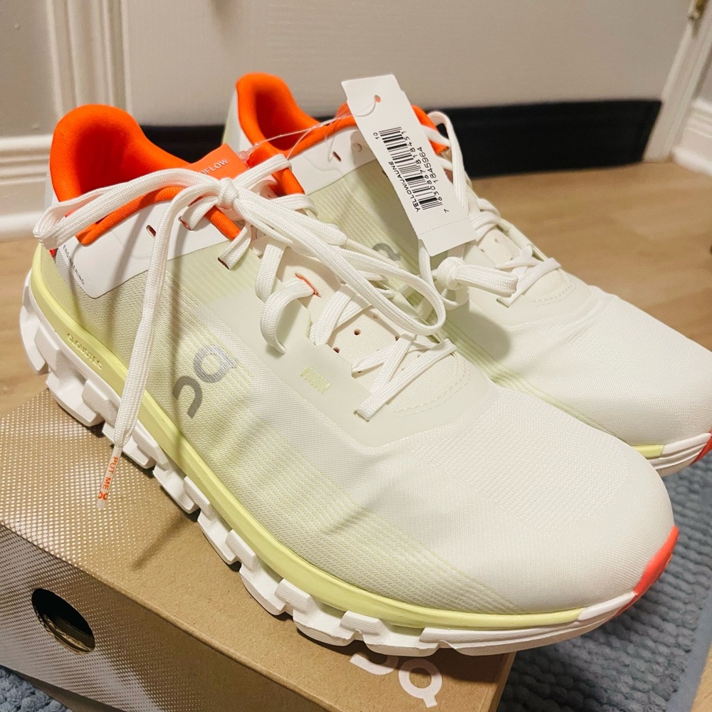 On Running White and Orange Sneakers
